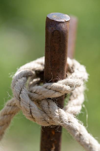 istock Rope knot tied to a metal pole on a blurred background 1439777569