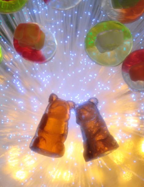 Closeup shot of gummy bears with the lights around them