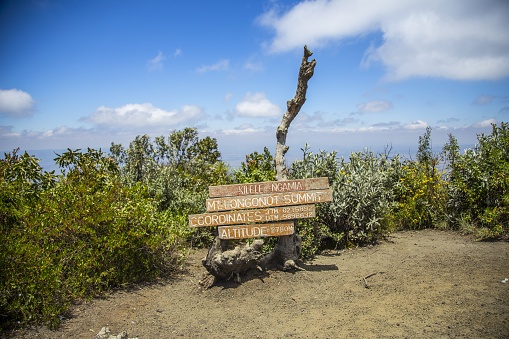 A wooden sign showing information about Naivasha Oloonongot Crater captured in Kenya