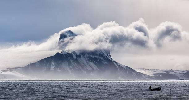 istock Panoramic view of an iceberg in clouds in Antarctica 1439780211