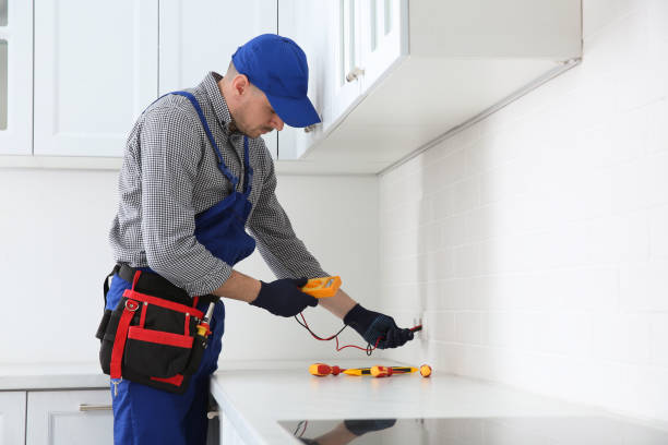 istock Professional electrician with tester checking voltage indoors 1439781221
