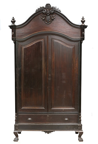A wooden vintage cabinet on white background