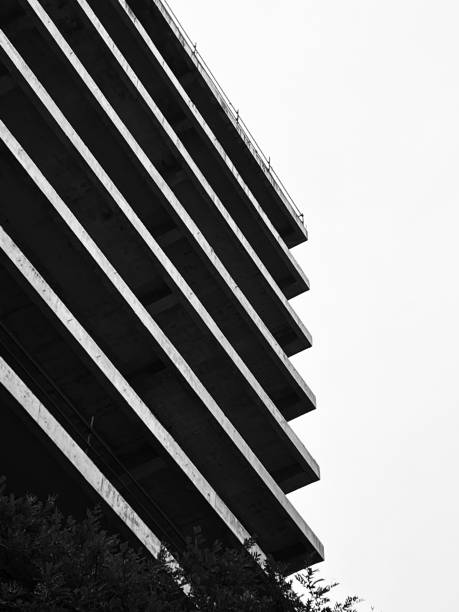 istock Grayscale vertical shot of a half-built building 1439781843