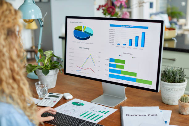 istock Businesswoman reviewing financial data on computer 1439781942