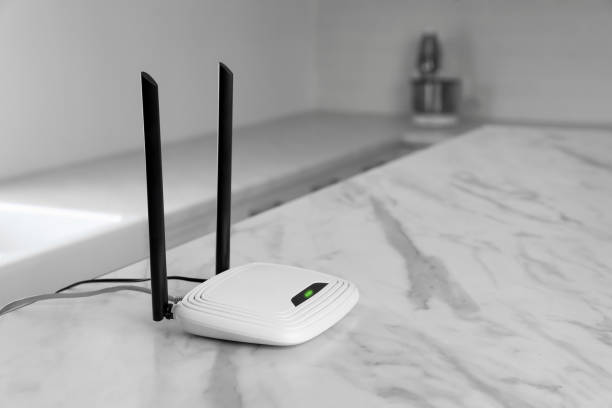 istock Modern Wi-Fi router on table indoors. Space for text 1439782490