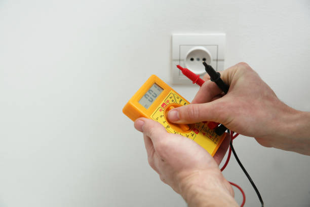 istock Electrician with tester checking voltage, closeup view 1439782855
