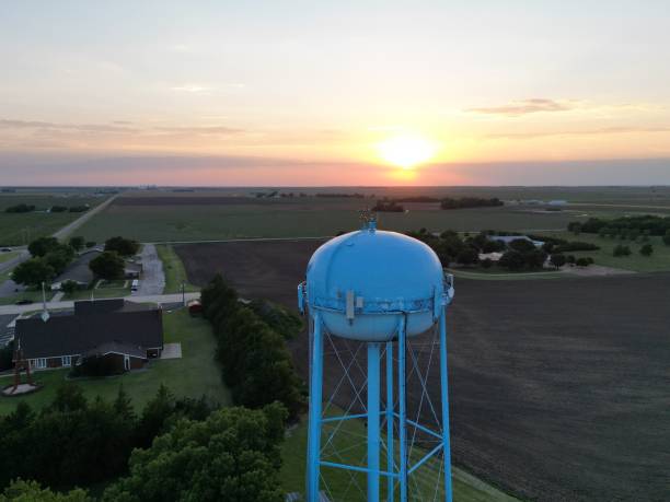 istock Aerial view of a Water Tower with fields in the background at sunset 1439783721