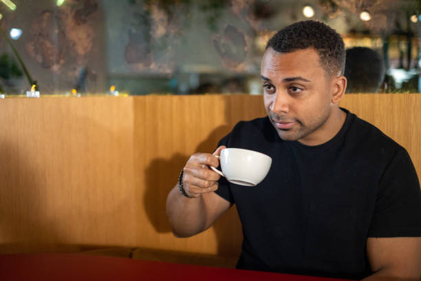 istock Sitting Alone Dessert Cafe Restaurant Coffee Tea Sipping 1439785995