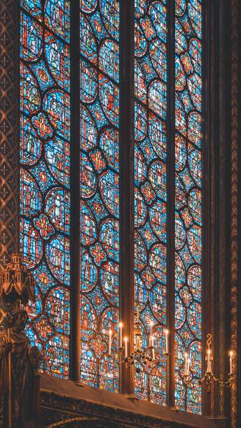 View of colorful stained glass window inside Sainte-Chapelle, Paris, France A view of colorful stained glass window inside Sainte-Chapelle, Paris, France sainte chapelle stock pictures, royalty-free photos & images