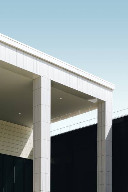 istock Vertical low angle shot of a white tiled building under the blue sky 1439790412