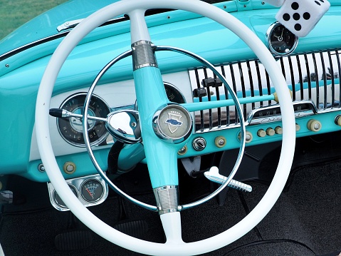 Springfield, United States – July 23, 2022: The close-up view of the blue Chevrolet bel air classic car wheel