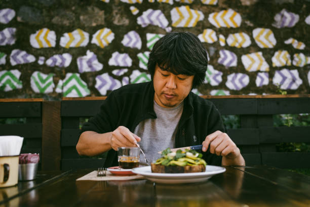 Traveler having breakfast next to the restaurant