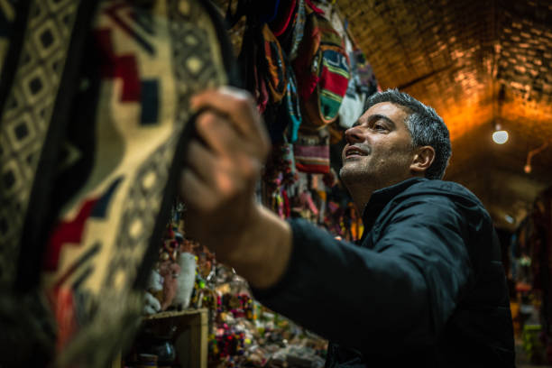 istock Man looking at products in a Chilean store 1439791656
