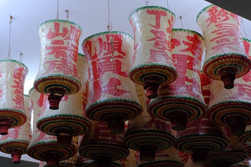 The traditional Chinese paper lanterns hanging from the ceiling