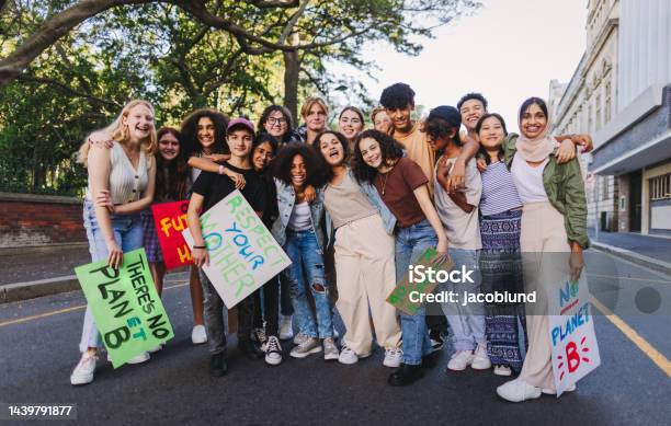 Diverse Youth Activists Holding A Climate Change Protest Stock Photo - Download Image Now