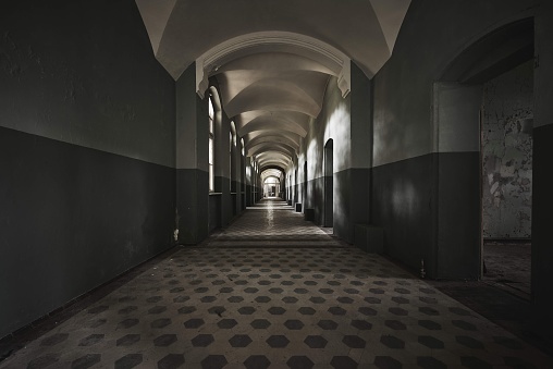 A beautiful view of the hallway in an old deserted building