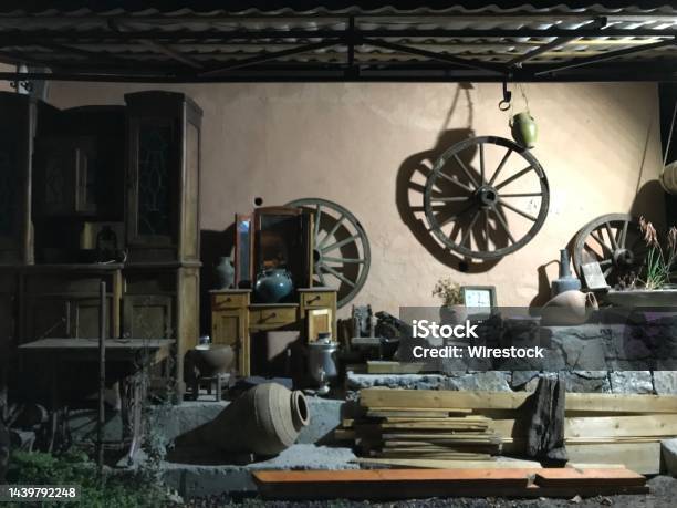 Old Attic With Ancient Goods Wooden Shelf Steering Wheel And Wood Planks Stock Photo - Download Image Now