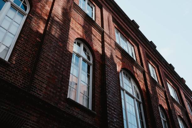 istock Low angle shot of a brown concrete building with arch windows - great for a cool background 1439792557