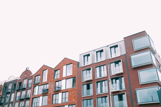 istock Low angle shot of a concrete brown building under the white sky 1439793216