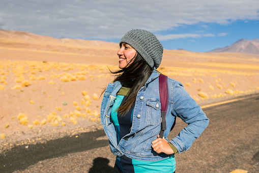 Woman on the road in the Chilean desert