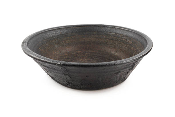istock Black empty earthen vessel isolated on white background. Traditional clay*pot  bowl isolated 1439795099