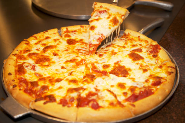 istock Hot Slice of Cheese Pizza 1439796489