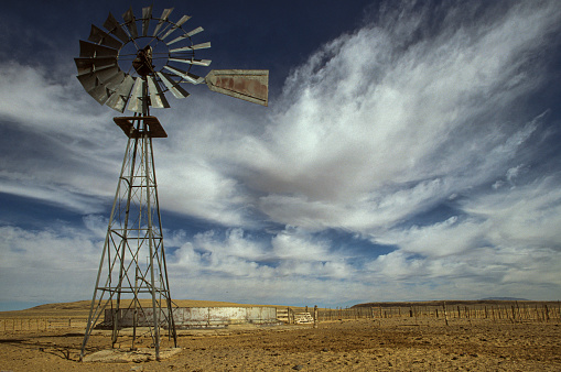 Windmill on arid ranch in New Mexico