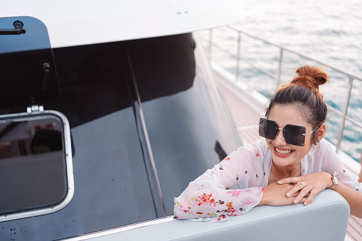 Beautiful woman on luxury yacht. Having fun and enjoying the sun, woman happy summer travel at sea. weekend activity lifestyle