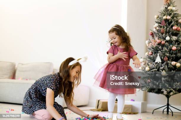 We Have To Clean Up The Confetti So Mom Doesnt See The Mess Stock Photo - Download Image Now