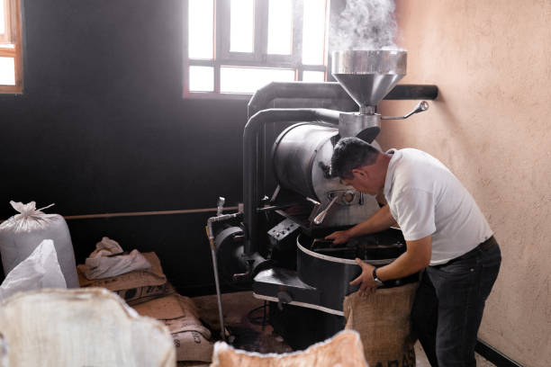 istock An Hispanic man is picking up the coffee with a sack from the roaster machine 1439798837