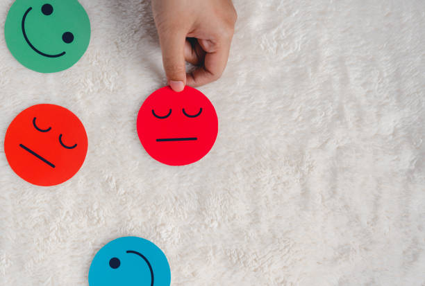 istock Hand selected angry or sad  face paper cut which is among various emotions, feedback rating , customer review, balance emotion control,mental health assessment, bipolar disorder unhappy of life concept 1439798947
