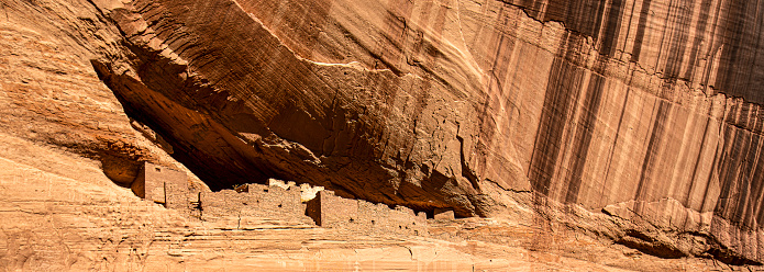 Varnish stains the high cliff walls of the cliff dwelling in Canyon de Chelly