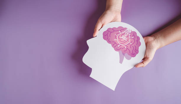 istock hands holding brain with light bulb paper cut, innovation idea creative, autism, Stroke, Epilepsy and alzheimer awareness, seizure disorder, stroke, ADHD, world mental health day 1439800656