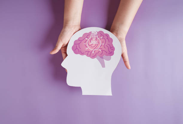 istock hands holding brain with light bulb paper cut, innovation idea creative, autism, Stroke, Epilepsy and alzheimer awareness, seizure disorder, stroke, ADHD, world mental health day 1439800664