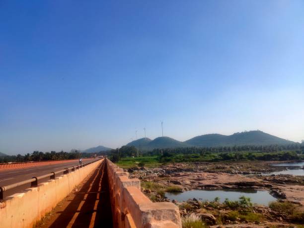 istock Bridge and mountain landscape on sunny day 1439800819