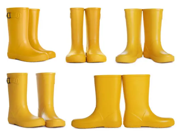 Set with yellow rubber boots on white background