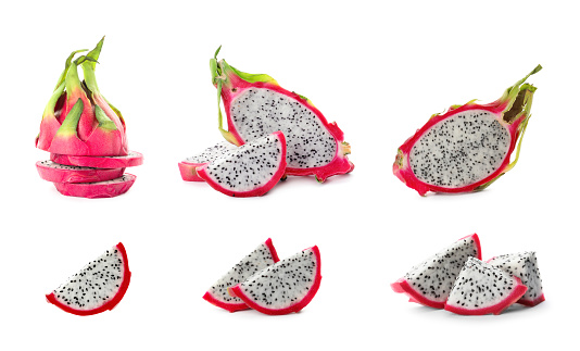 Set with delicious pink dragon fruits (pitahaya) on white background