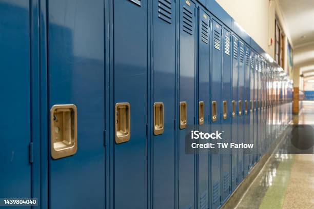 Photo Of A Blue Metal Lockers Along A Nondescript Hallway In A Typical Us High School No Identifiable Information Included And Nobody In The Hall Stock Photo - Download Image Now