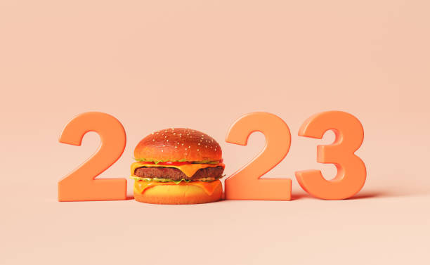 2023 figures with tasty burger 3D illustration of 2023 figures with yummy burger instead of zero against peach background spanish hamburger stock pictures, royalty-free photos & images