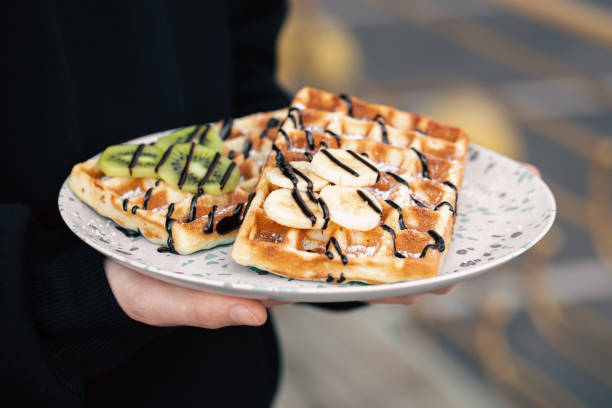 istock Close-up, Belgian waffles with fruits, covered with chocolate. 1439805734