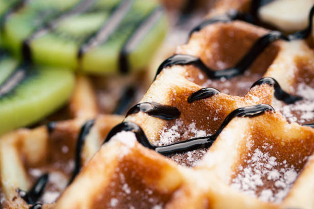 istock Close-up, Belgian waffles with fruits, covered with chocolate. 1439805744