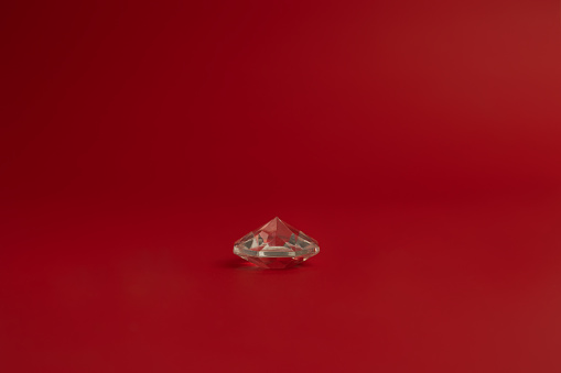 Crystal pyramid on red background