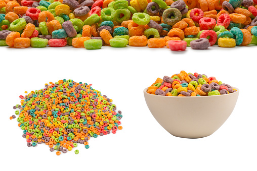Sweet multicolored flakes, cereal loops. Isolated on a white background.