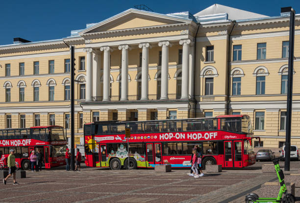 Hop-on Hop-off bus in front of govenment office, Helsinki, Finland stock photo