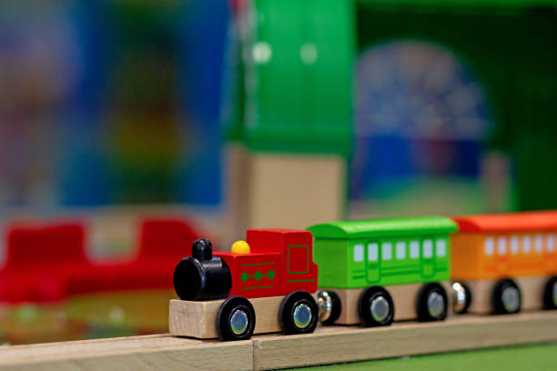 istock Wooden toy train chain in play room 1439808743