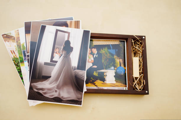 istock printed wedding photos and a wooden box with a flash drive. 1439808840