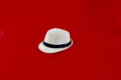 A hat on red background
