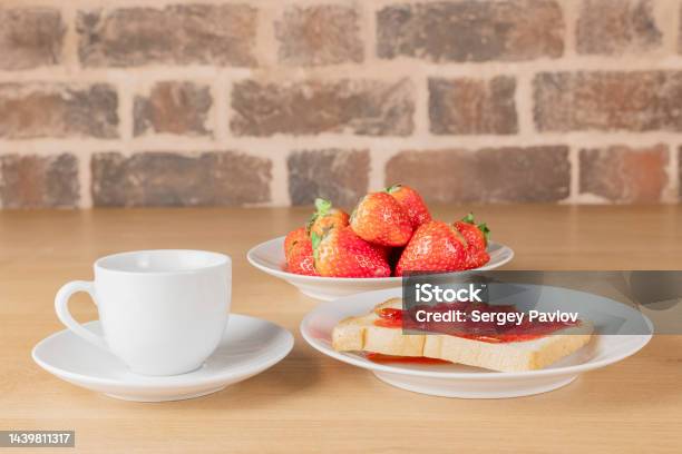 Breakfast Toast With Jam A Cup Of Coffee And Strawberries Stock Photo - Download Image Now