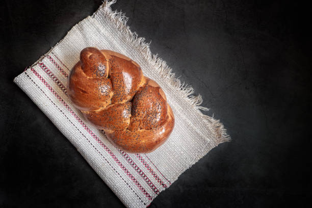 A loaf of white bread on a linen napkin