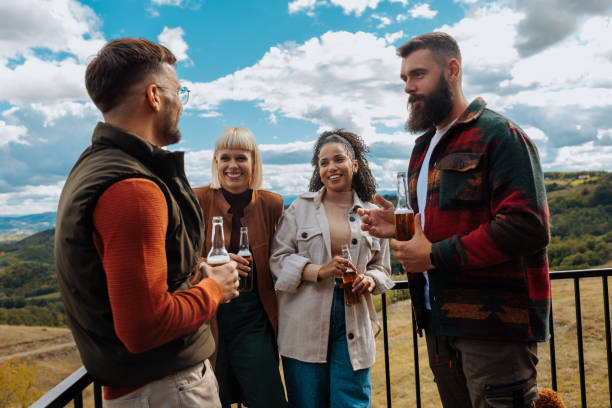 istock Friends socializing on mountain. 1439811931